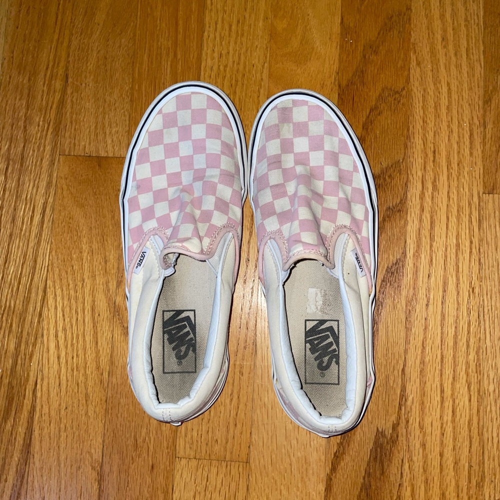 White and pink slip on checkered vans